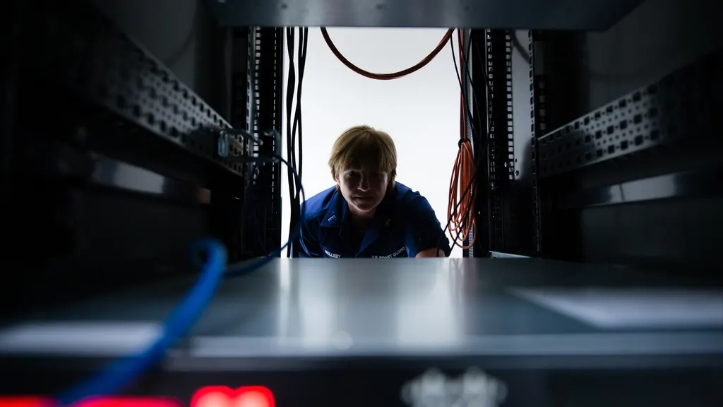 Person looking through a server rack