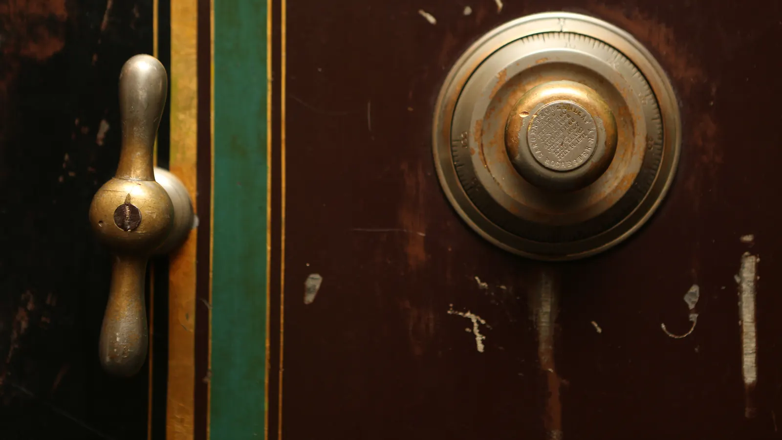 Lock and handle on an old metal safe door