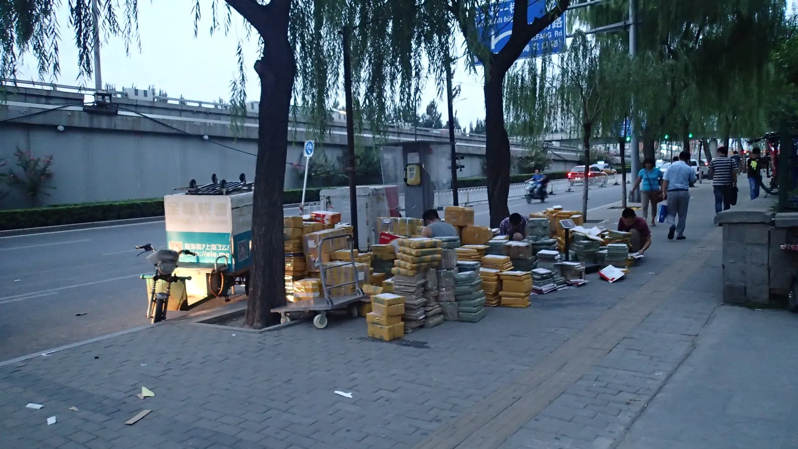 Parcels stacked on a city pavement for delivery