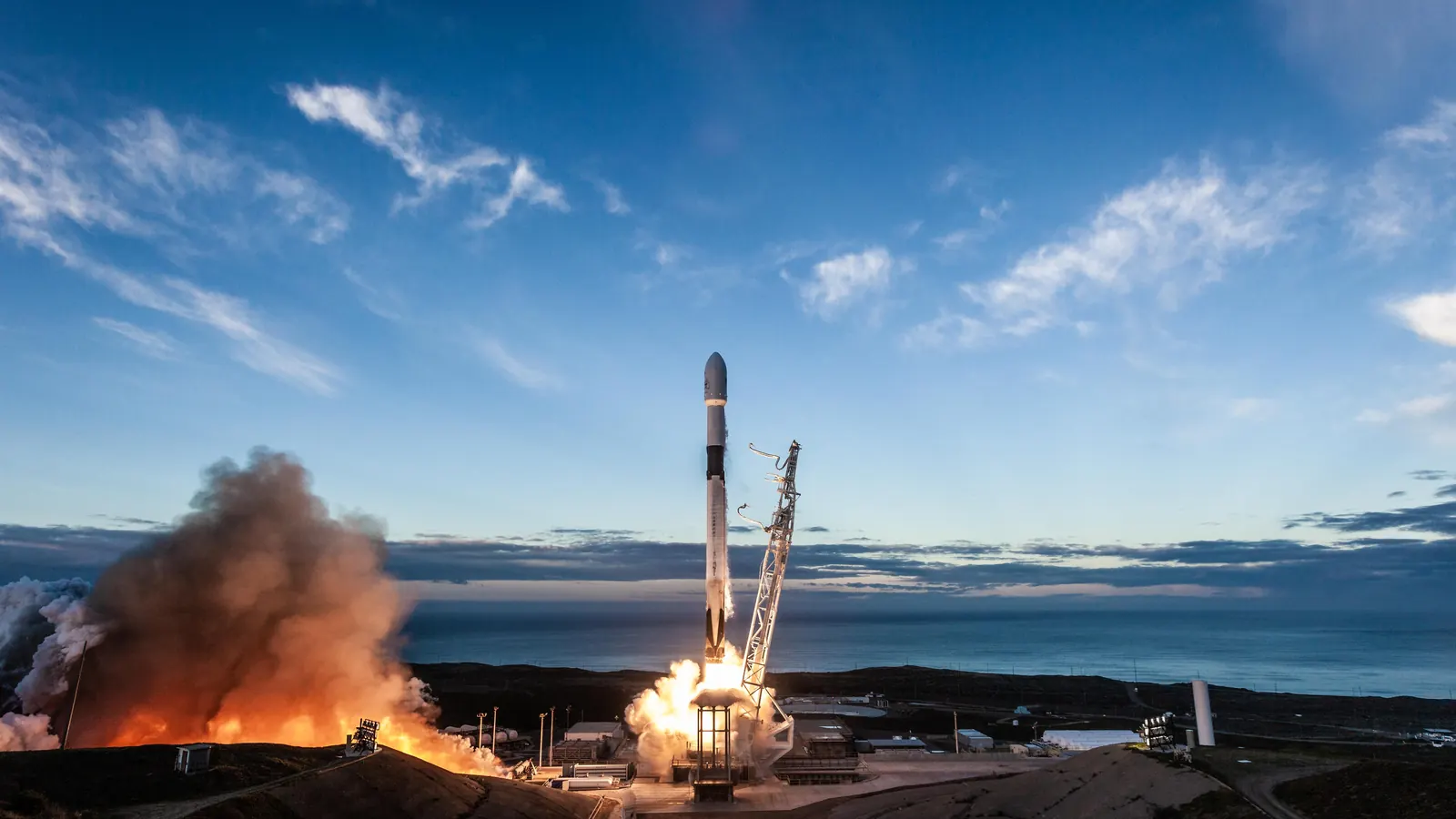 Rocket lifting off from a launch pad