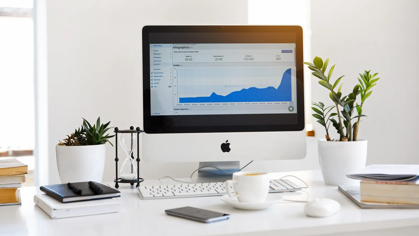 Desktop computer displaying a usage graph on a tidy desk