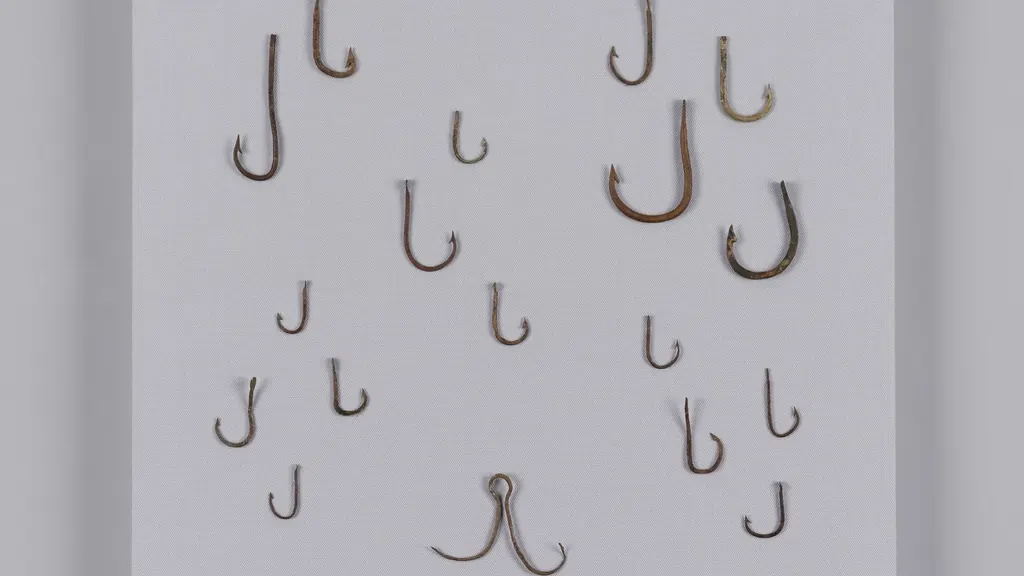 Fish hooks hanging against a white wall