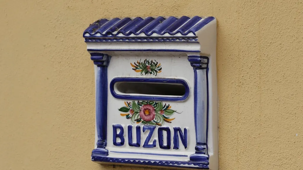 Decorated tile mailbox on a wall