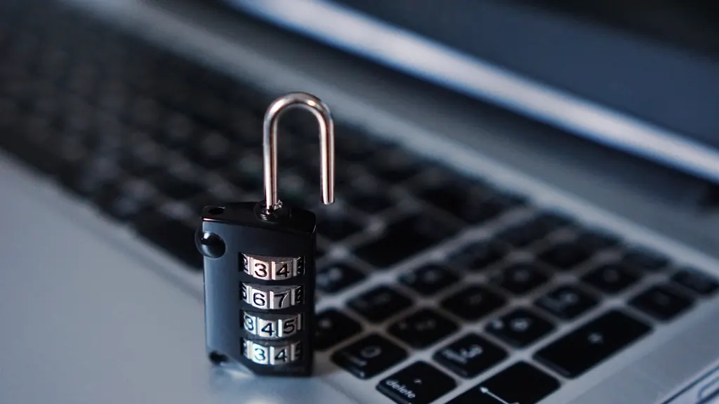 Combination padlock on a laptop keyboard