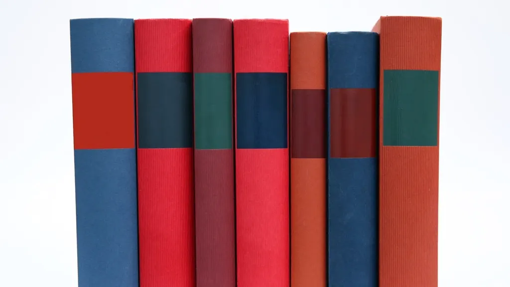 Row of coloured folders standing upright