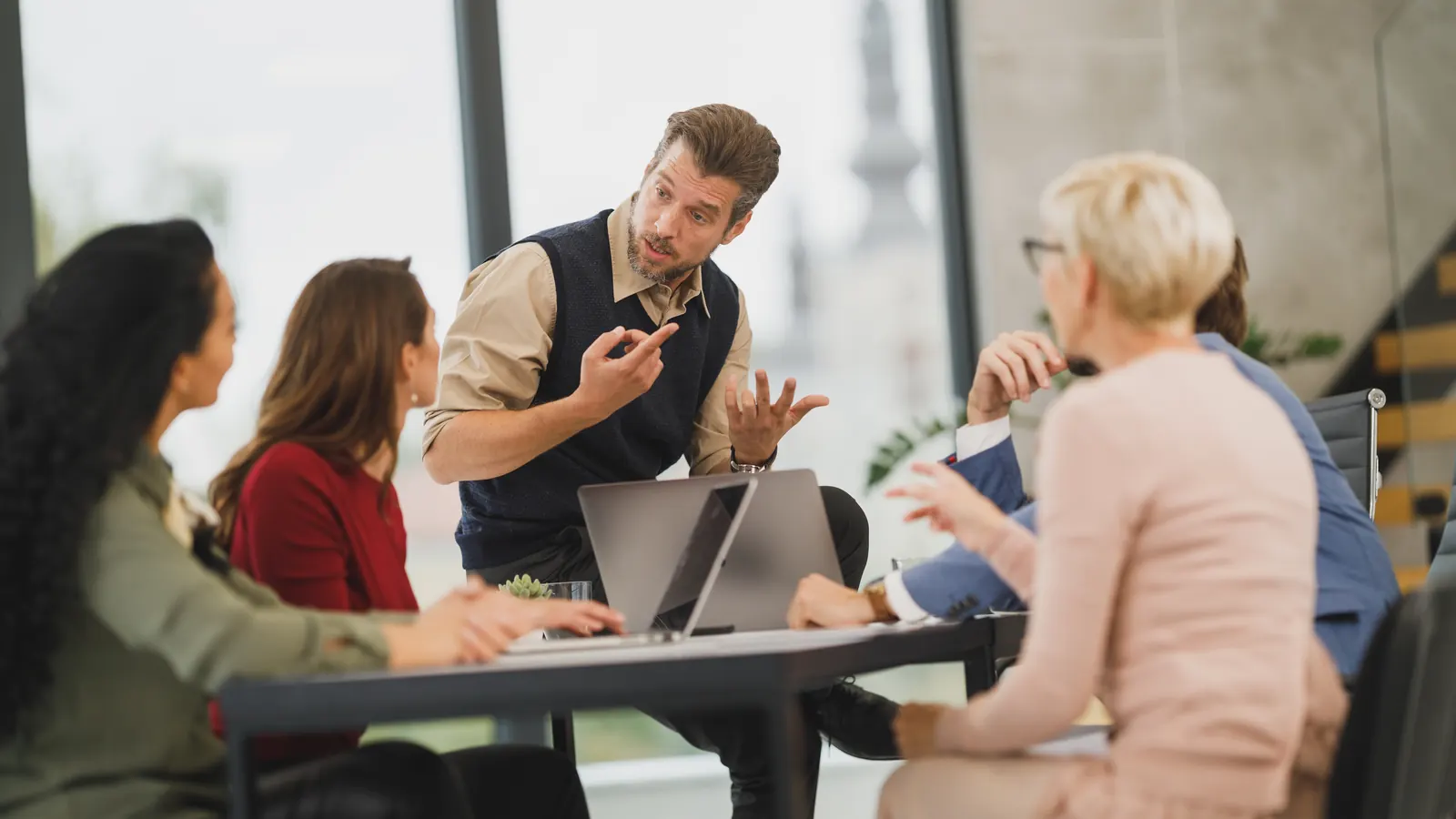 Business team discussing a project around a meeting table