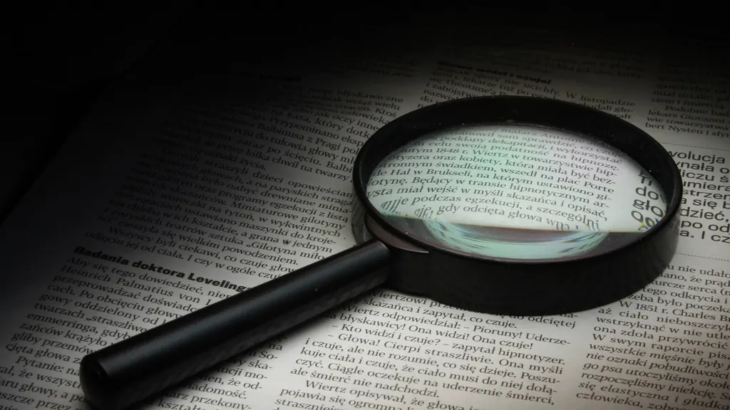 Magnifying glass on an open book